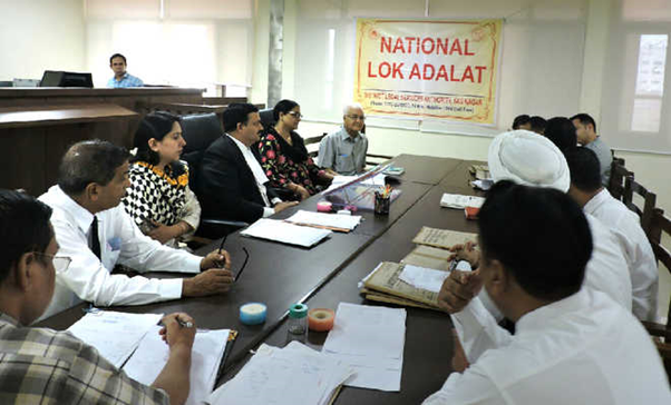 Explain and distinguish between Lok Adalats And Arbitration Tribunals